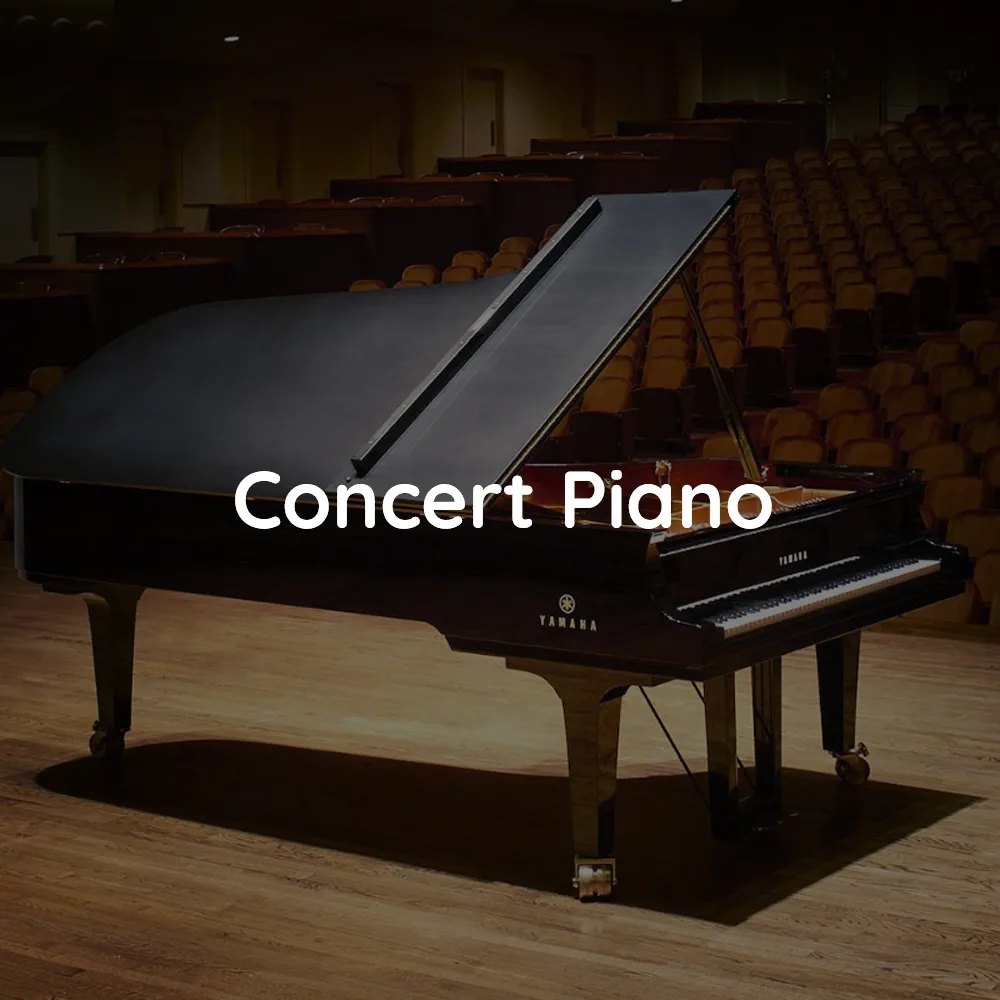 A grand piano on a concert hall stage