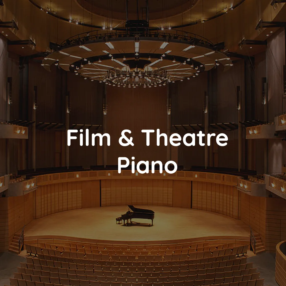 An auditorium with a grand piano on the stage