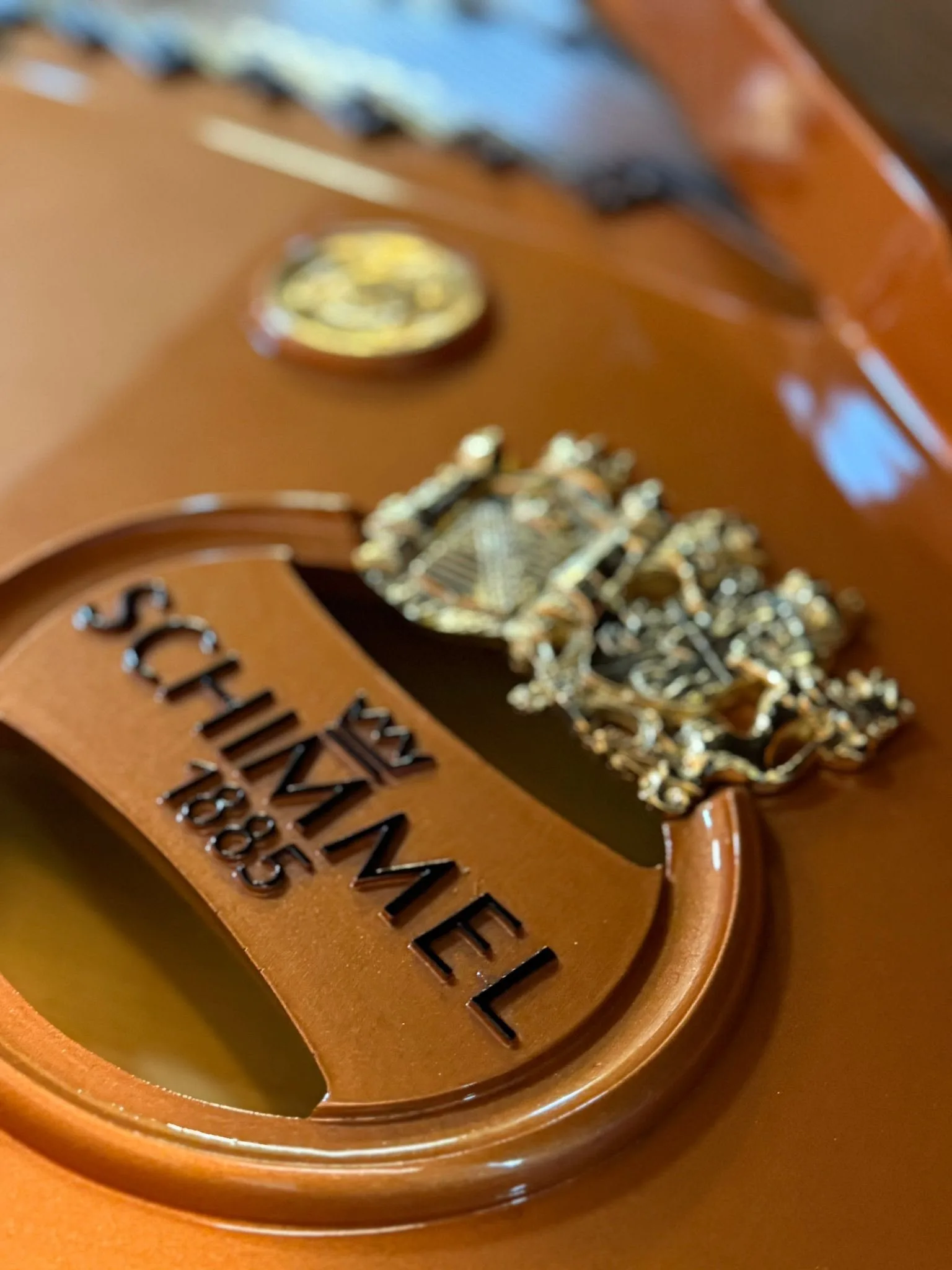 The Schimmel crest and the year 1885 inside a grand piano