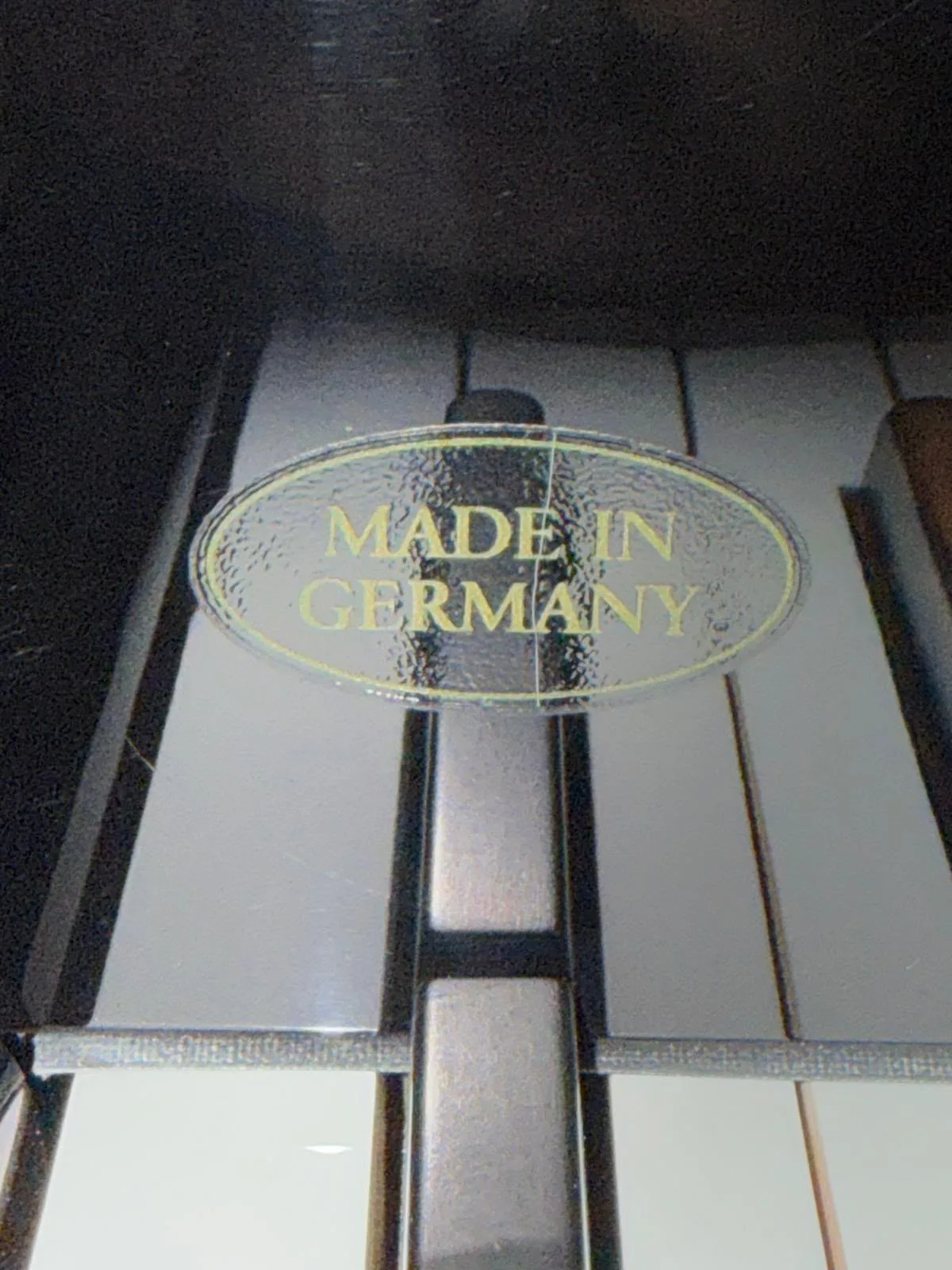 A Made in Germany mark on the keyboard of a Schimmel grand piano