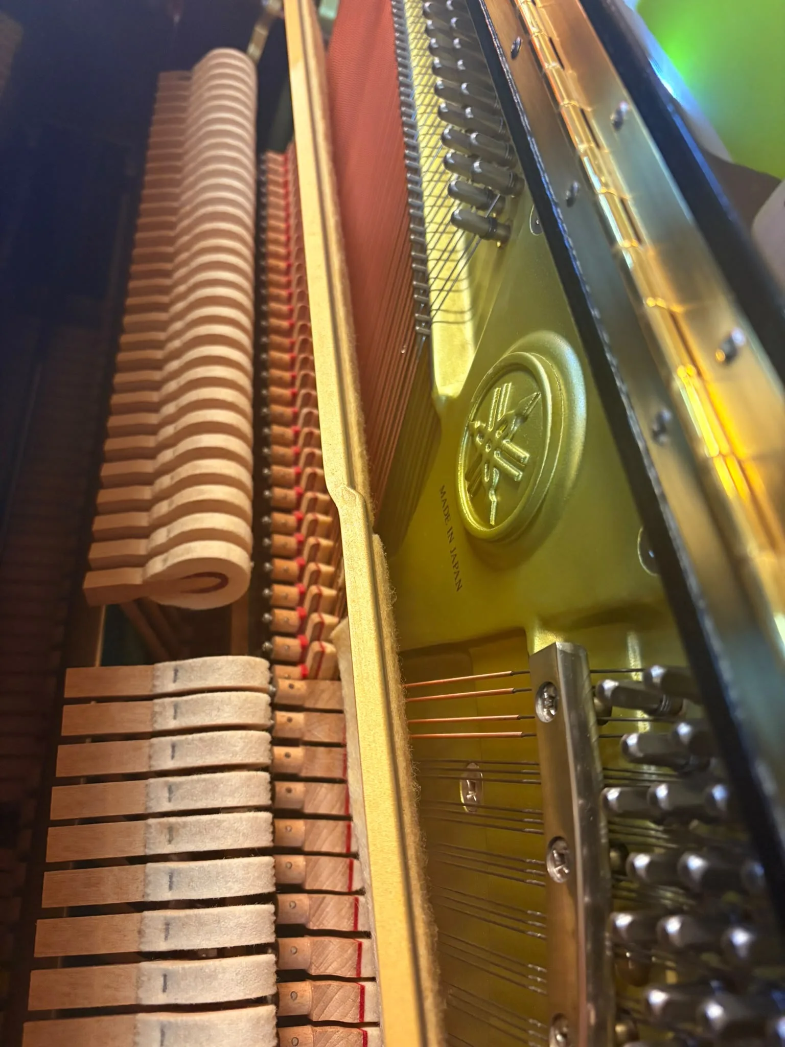 The hammers and action of a Yamaha upright piano seen from above
