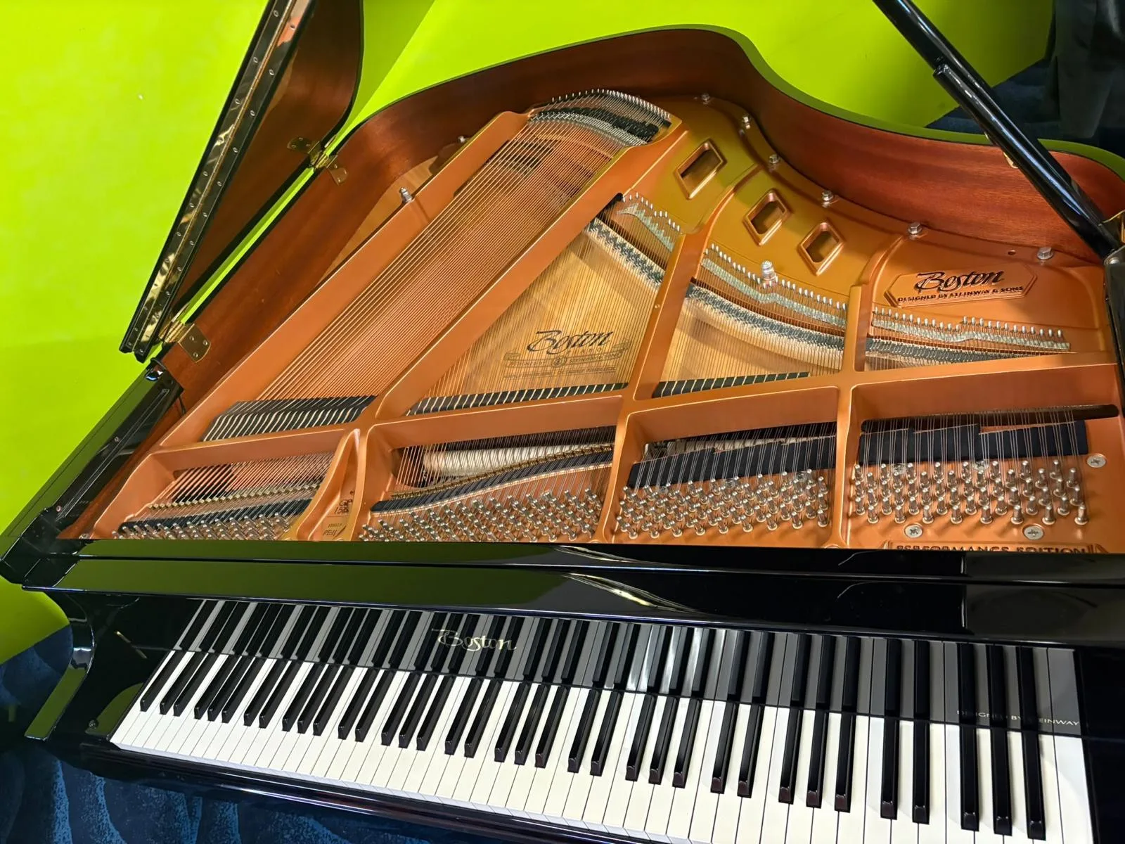 The Boston name cast twice into the plate of a grand piano