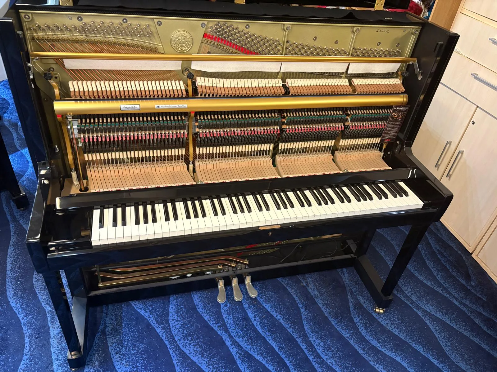 A Kawai K-600AS upright piano open on the floor at IMM