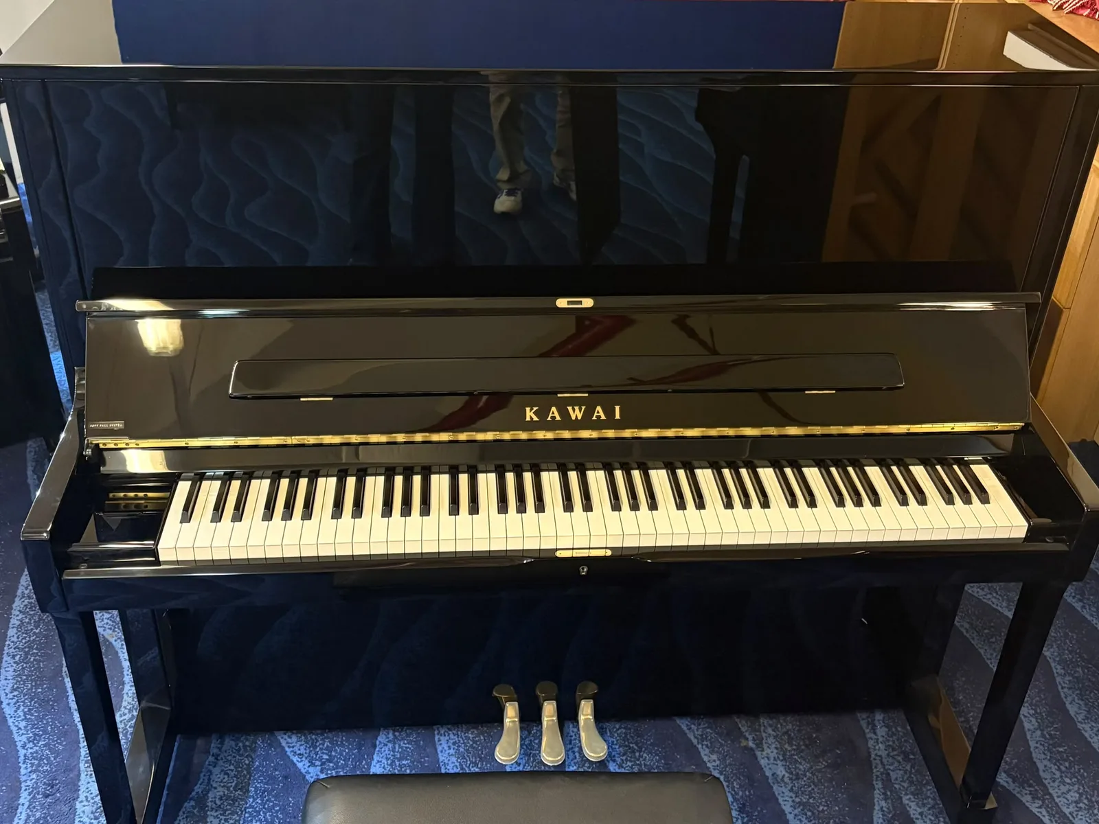 The keyboard and fallboard of a Kawai upright piano